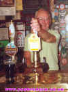 Brian Moore behind the bar at the Cask & Cutler Aug 98