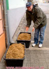 Dean with the spent mash from Richter brewery Prague 020208